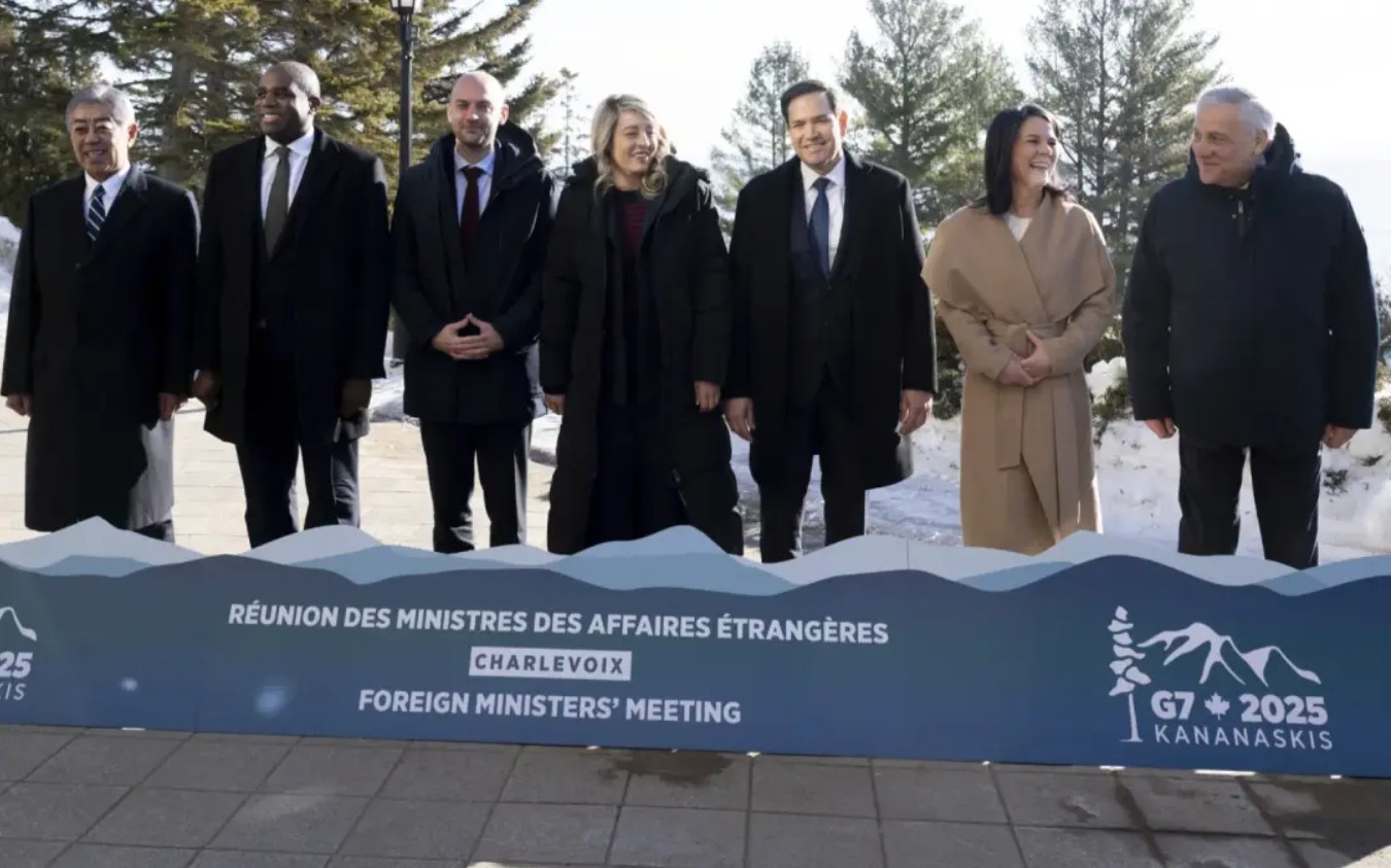 Fog over tall snowy mountains